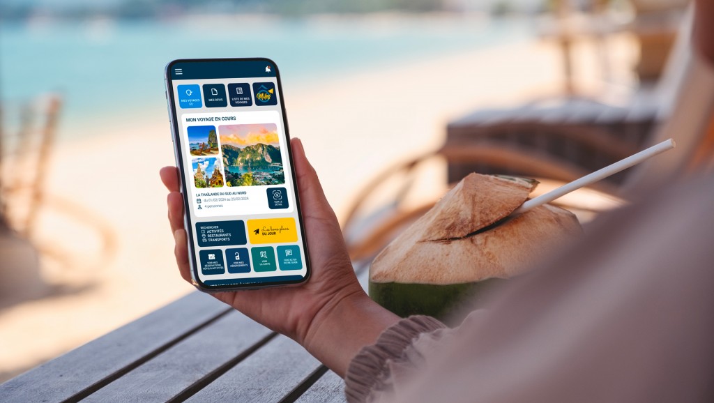 mockup-image-woman-holding-mobile-phone-with-blank-desktop-screen-beach 1